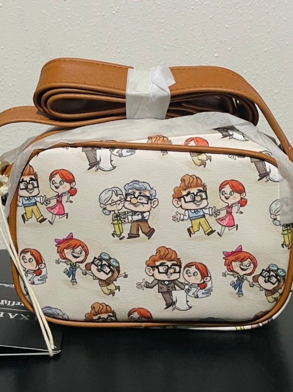 Loungefly White Crossbody Bag with Tan Trim and Multicolor Cartoon Print